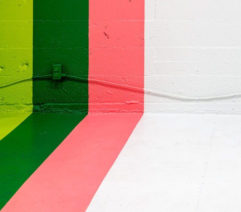 white, pink, green, and yellow painted wall